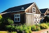 A summer garden blooms at a rustic barn in a winery in Jamesport Long Island