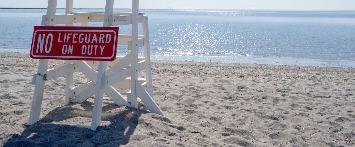 Empty lifeguard chair at Short Beach in Stratford Connecticut during the day.