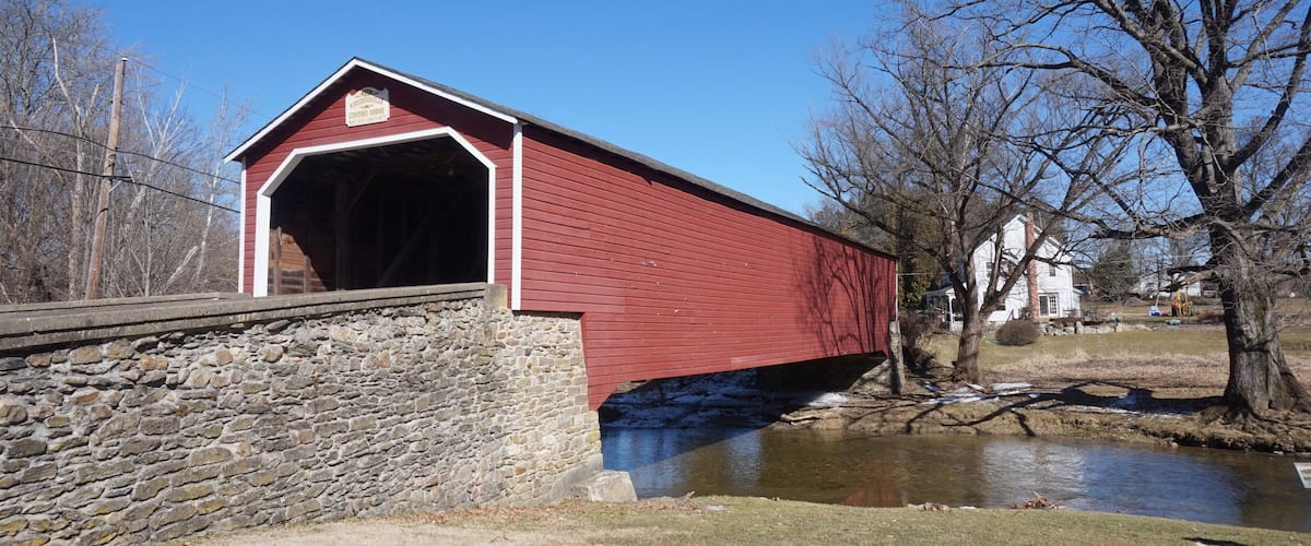 Entrance to Kreidersville Red Wooden Covered Bridge on Sunny Winter Day