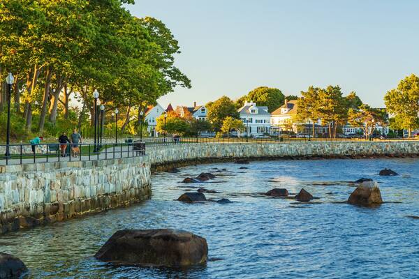 Stage Fort Park showing a coastal town and a bay or harbor