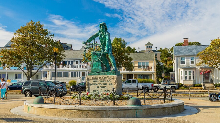 Fishermen\'s Memorial Monument featuring a statue or sculpture and a small town or village