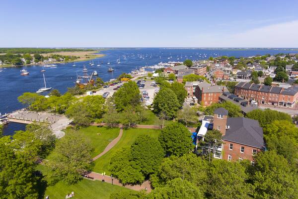 Newburyport historic downtown including Merrimack Street and Waterfront Promenade Park with Merrimack River at the background aerial view, Newburyport, Massachusetts, MA, USA.