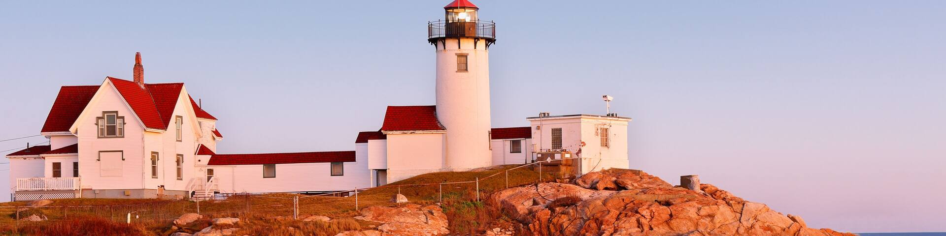 Beautiful sunset of Eastern Point Lighthouse at Gloucester, Massachusetts, USA. The Lighthouse is One of Five iconic lighthouses along the Cape Ann coastline.