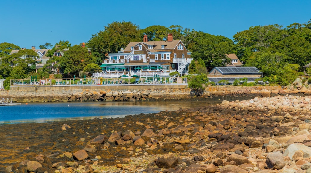 Eastern Point Lighthouse featuring a house, general coastal views and a bay or harbor