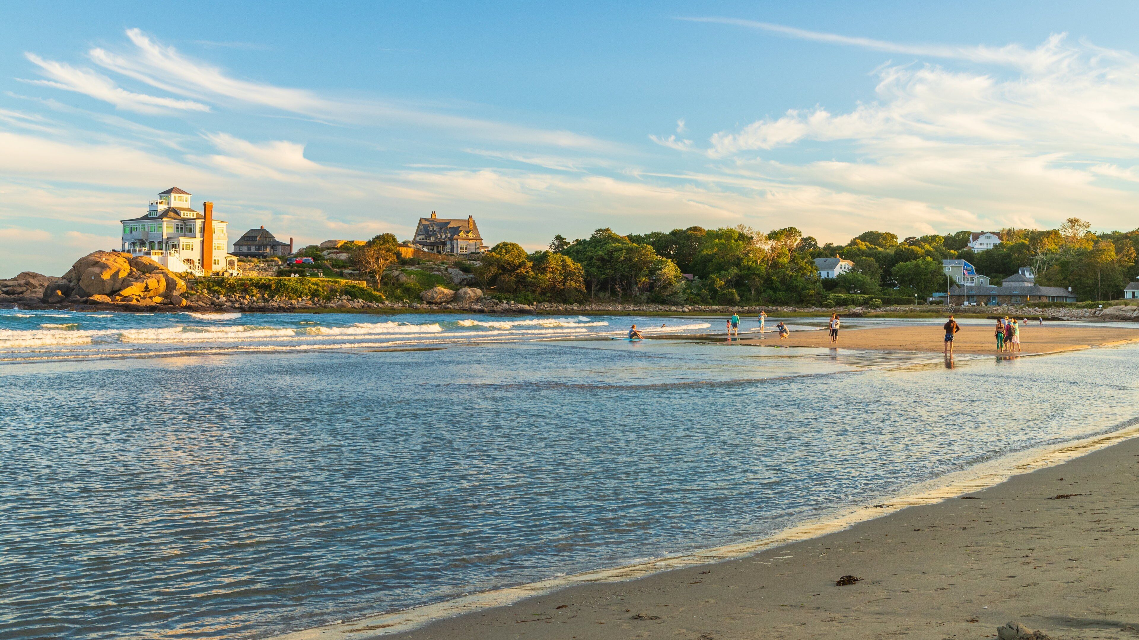 Good Harbor Beach which includes general coastal views, a sandy beach and a sunset