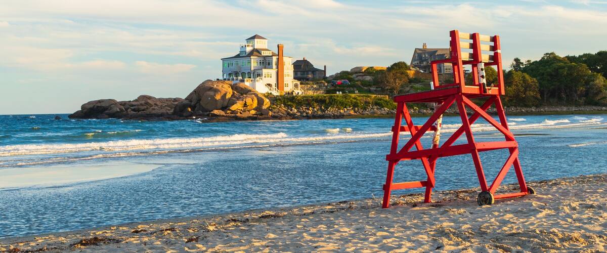 Good Harbor Beach which includes general coastal views, a sunset and a sandy beach