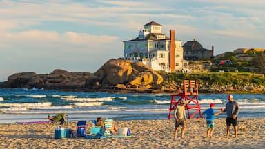 Good Harbor Beach featuring a sunset, a sandy beach and general coastal views