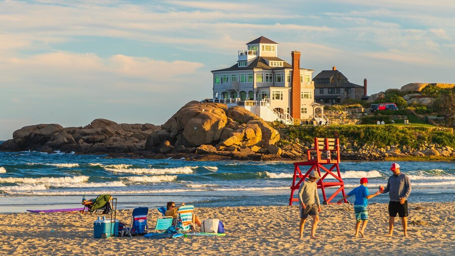 Good Harbor Beach featuring a sunset, a sandy beach and general coastal views