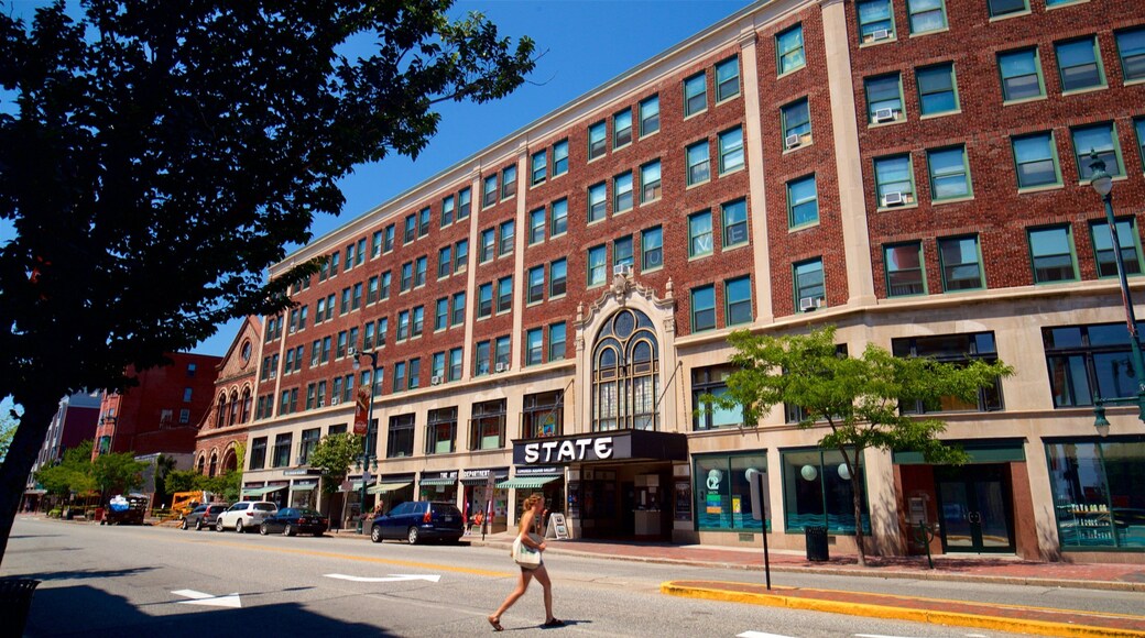 State Theatre featuring street scenes as well as an individual femail