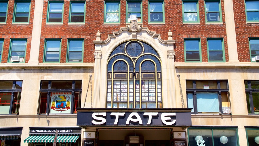 A building with a large arched window and a sign that reads "STATE".