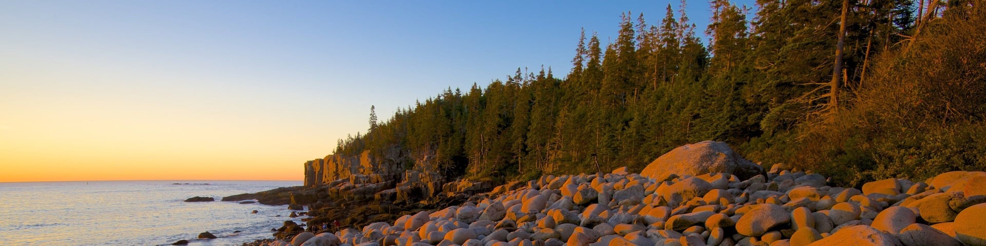 Otter Cliff showing a sunset, a pebble beach and general coastal views
