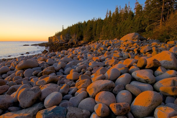Otter Cliff showing a sunset, a pebble beach and general coastal views