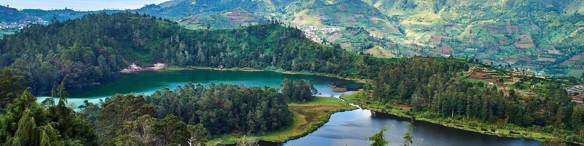 Two coloured lake
Not far from Dieng Theatre, there is a path to the top that you can reach this spot.
From here, you can see the two coloured lake from above. Local call this lake as Telaga Warna, which is real two different colour. 
The place is quite touristy so you may need to take turn to take a shot.
#outdoor #lake #sky #landscape #mountain #green