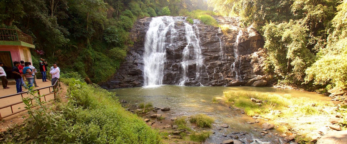 Madikeri which includes a lake or waterhole and a cascade