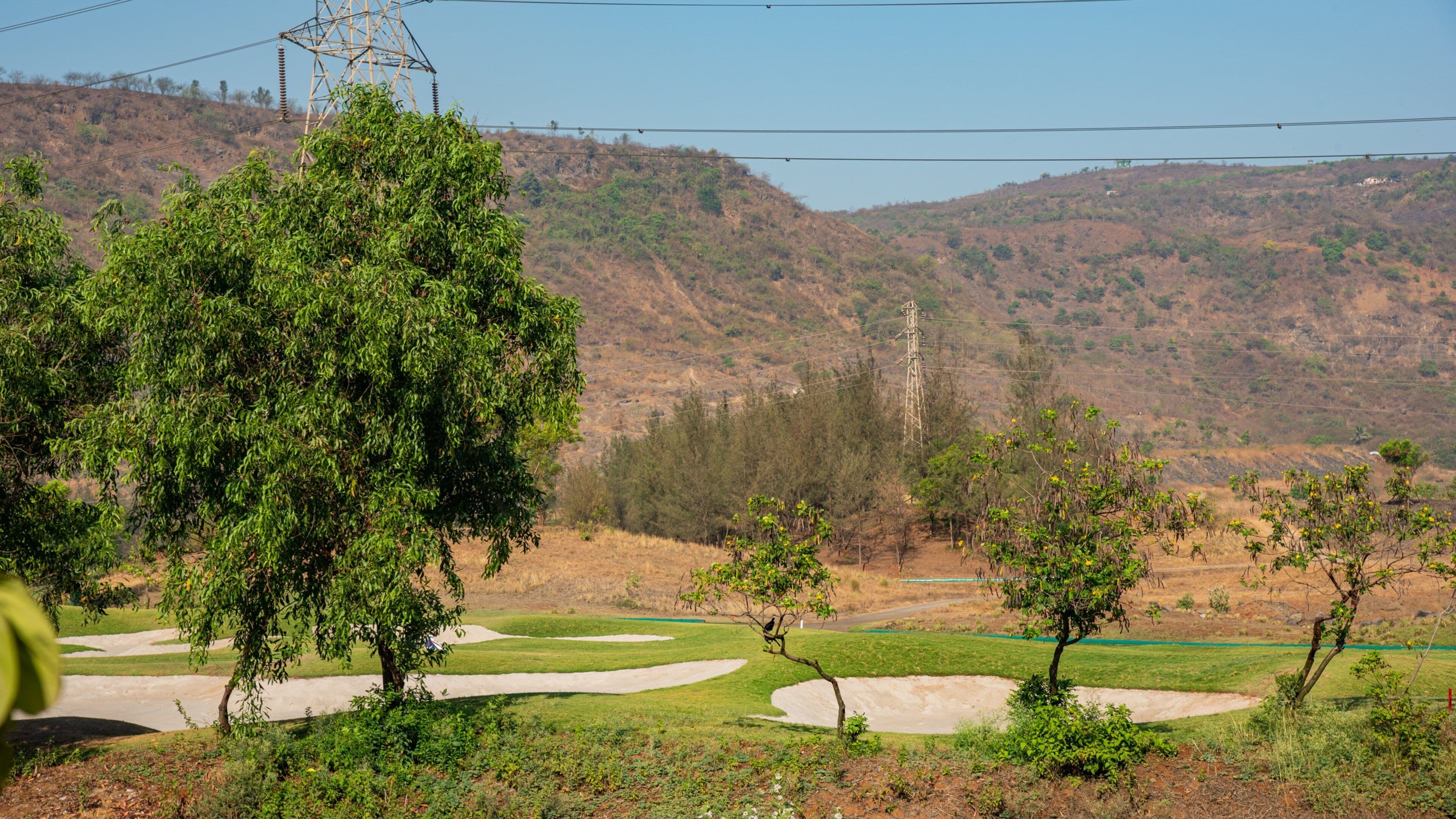 Kharghar Valley Golf Course which includes a park and tranquil scenes