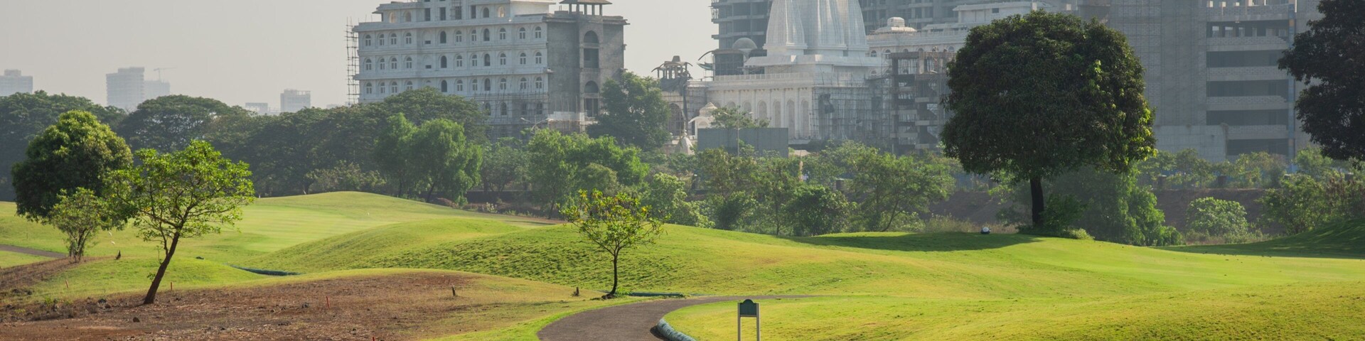 Kharghar Valley Golf Course featuring a city and golf