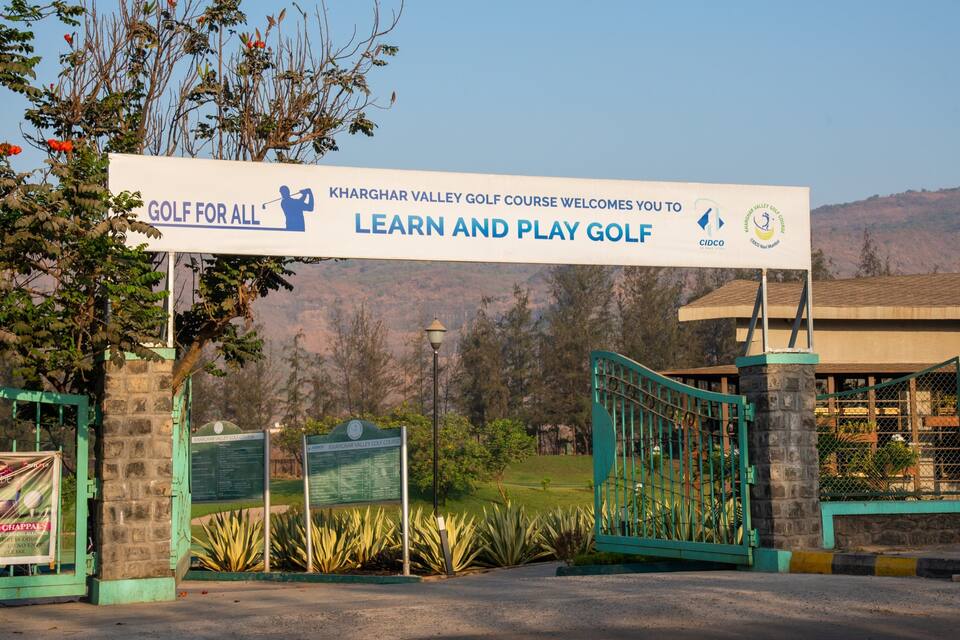 A sign welcoming visitors to the Kharghar Valley Golf Course.