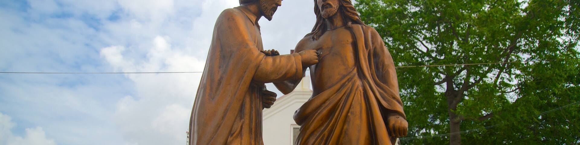 Chennai featuring religious elements and a statue or sculpture