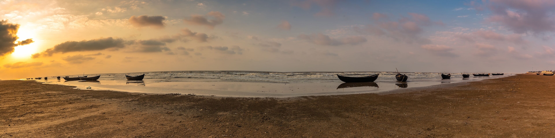 Silhouette Boats anchored on the sea Beach at Digha beach.