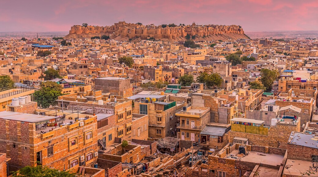 The golden city of Jaisalmer glows beneath the setting sun in Rajasthan, India