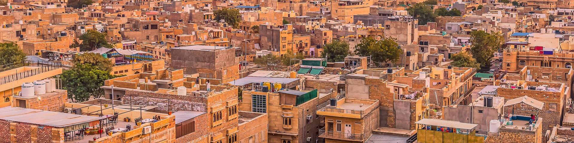 The golden city of Jaisalmer glows beneath the setting sun in Rajasthan, India