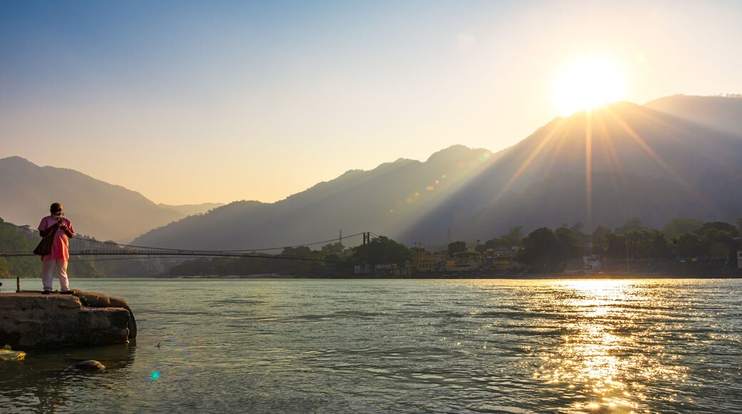 Spectacular panoramic cityscape of Rishikesh during sunrise, the yoga capital of World located in foothills Himalayas along banks of river Ganga or Ganges in Uttarakhand state of India.