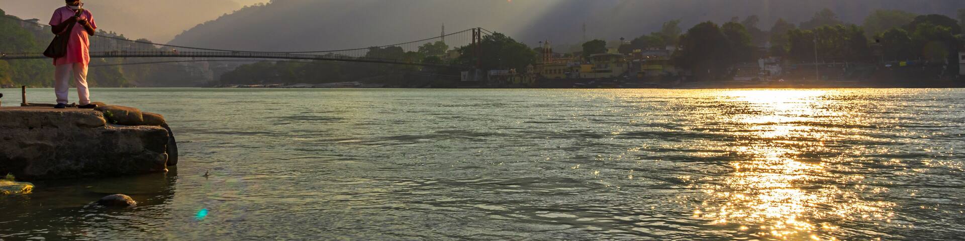 Spectacular panoramic cityscape of Rishikesh during sunrise, the yoga capital of World located in foothills Himalayas along banks of river Ganga or Ganges in Uttarakhand state of India.