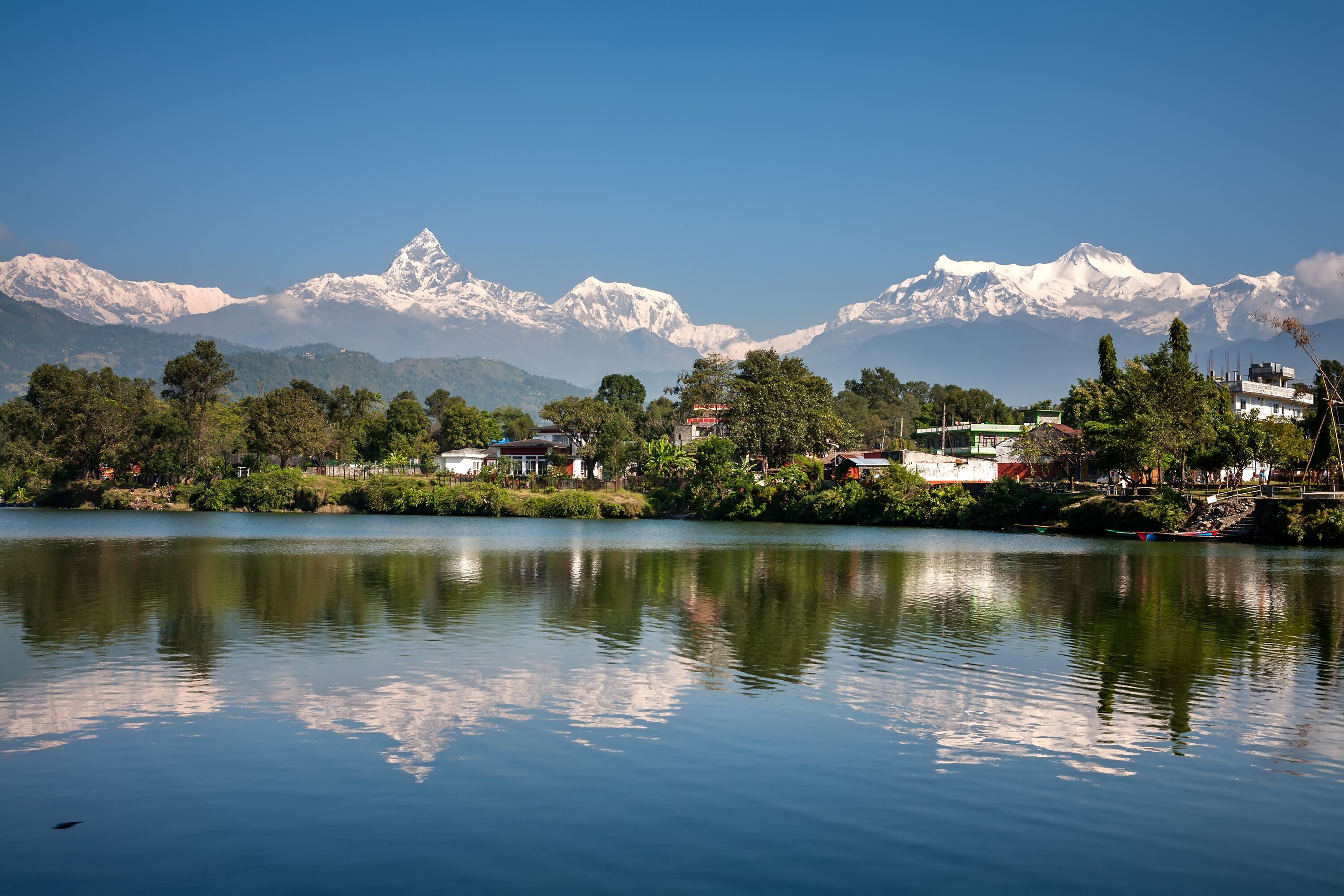 View at Annapurna mountain range and its reflection in Phewa lake in Pokhara, Nepal
