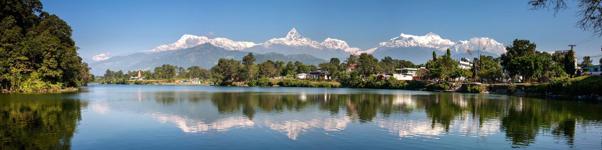 View at Annapurna mountain range and its reflection in Phewa lake in Pokhara, Nepal