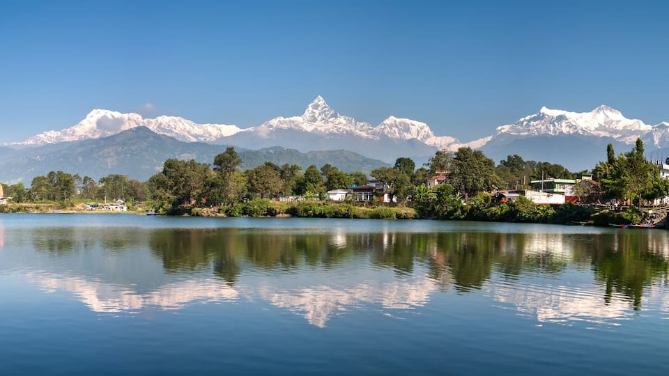 View at Annapurna mountain range and its reflection in Phewa lake in Pokhara, Nepal