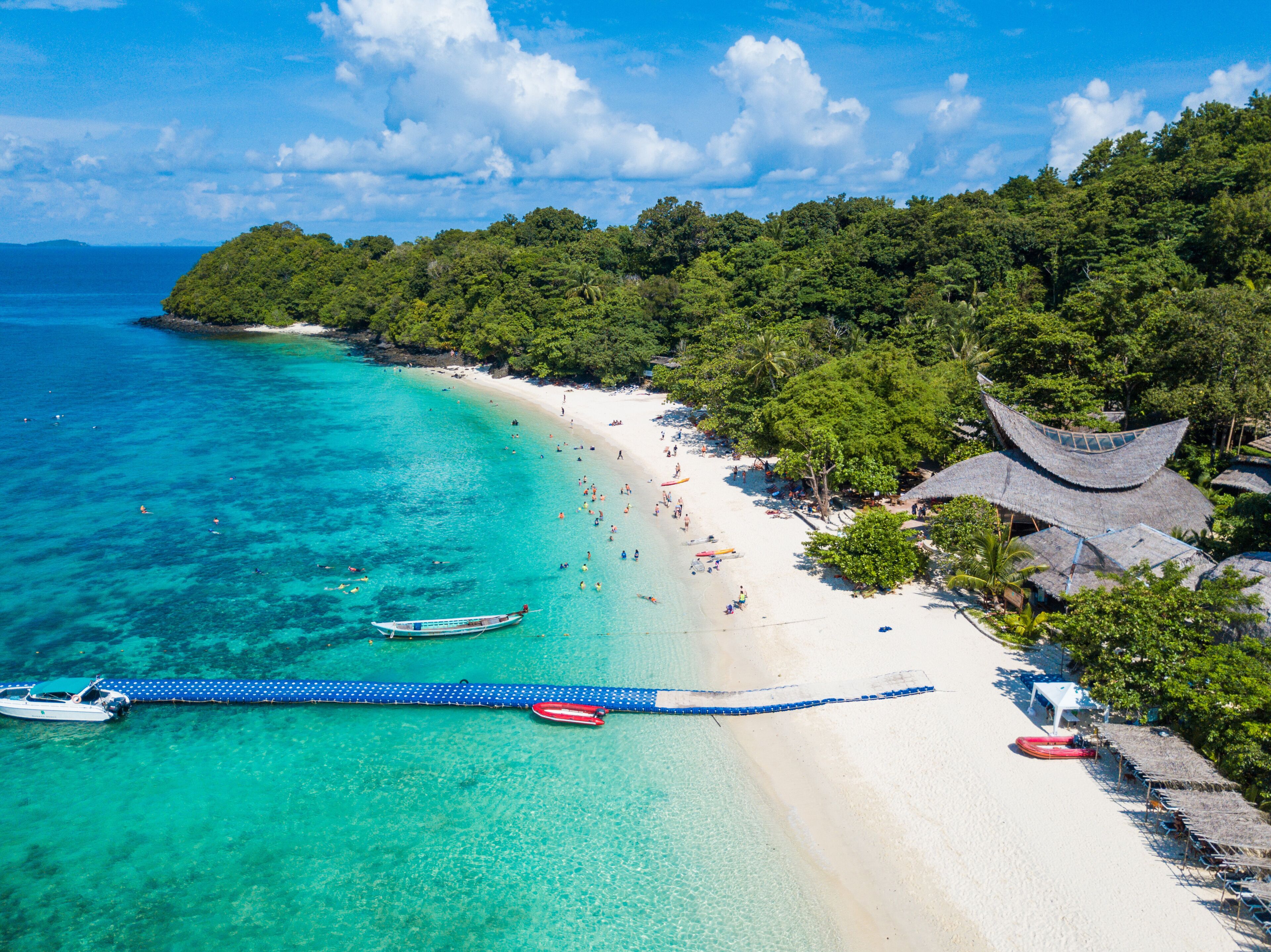 Aerial view or top view of tropical island beach with clear water at Banana beach, Coral Island, Koh Hey, Phuket