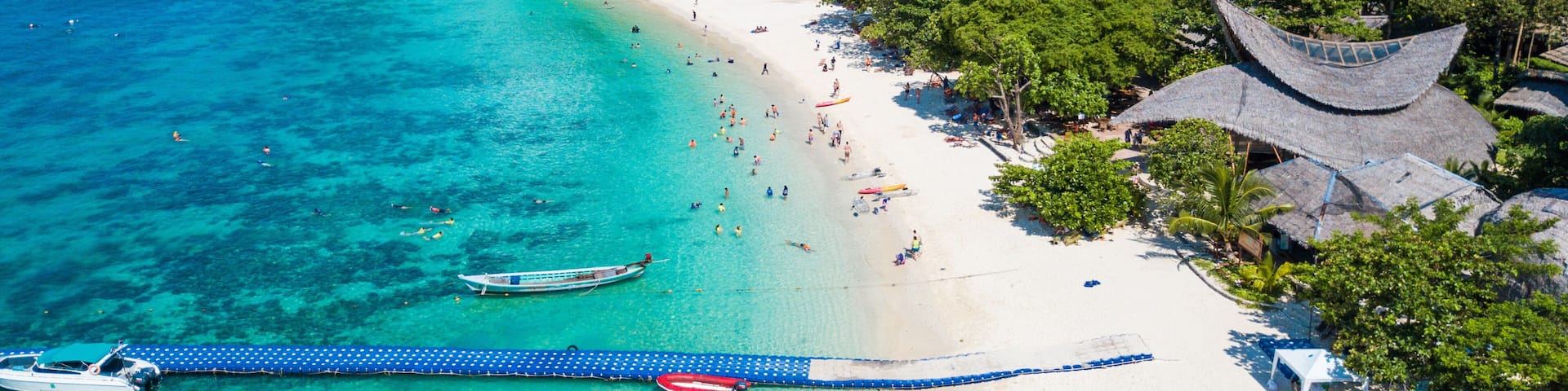 Aerial view or top view of tropical island beach with clear water at Banana beach, Coral Island, Koh Hey, Phuket