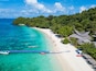 Aerial view or top view of tropical island beach with clear water at Banana beach, Coral Island, Koh Hey, Phuket