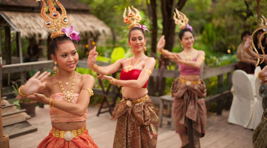 Thai women dancing in traditional dress at Siam Niramit, Bangkok, Thailand, Asia