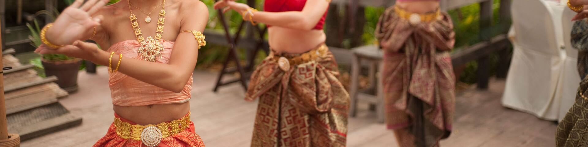 Thai women dancing in traditional dress at Siam Niramit, Bangkok, Thailand, Asia
