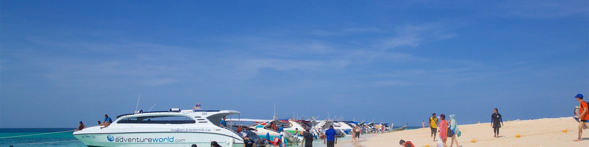 Bamboo Island which includes a sandy beach, general coastal views and boating