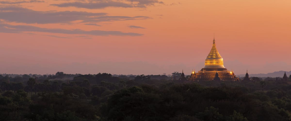 Sunset view of the gilded Dhammayazika Pagoda, as seen from the Pyathetgyi Pagoda