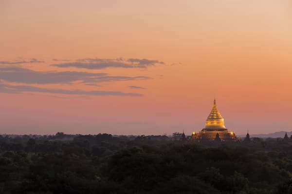 Sunset view of the gilded Dhammayazika Pagoda, as seen from the Pyathetgyi Pagoda