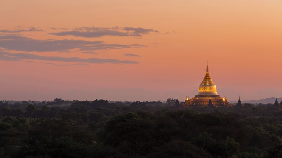 Sunset view of the gilded Dhammayazika Pagoda, as seen from the Pyathetgyi Pagoda