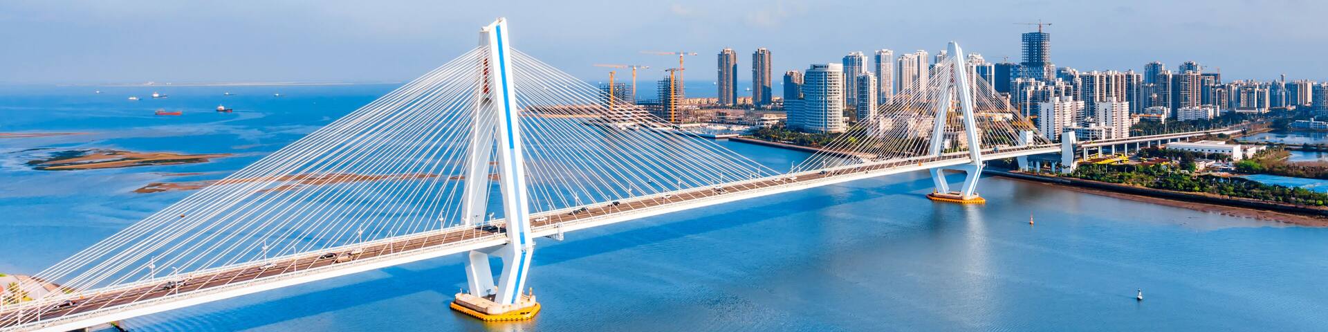 High view sunny day scenery of Century Bridge on Haidian River, Haikou, Hainan, China