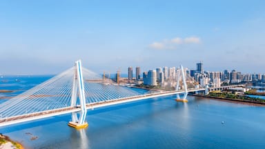High view sunny day scenery of Century Bridge on Haidian River, Haikou, Hainan, China