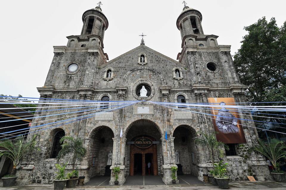A historic church with two bell towers and a large arched entrance.