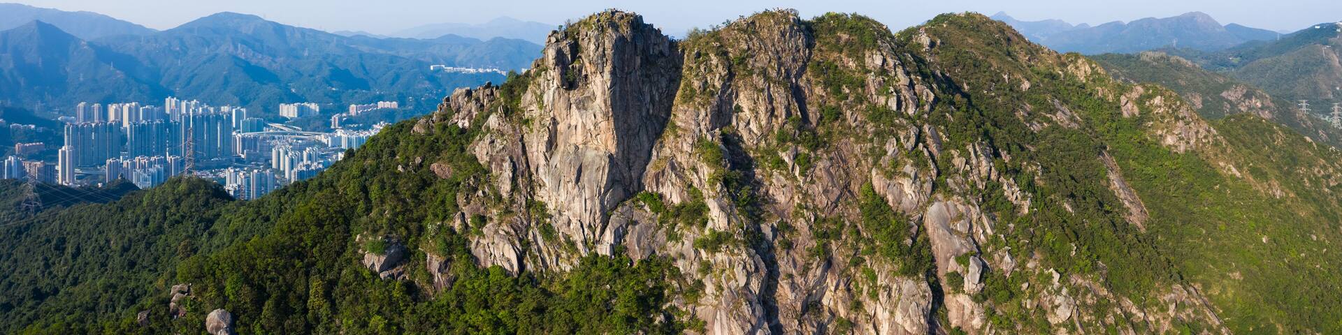 A mountainous landscape with a city in the background.