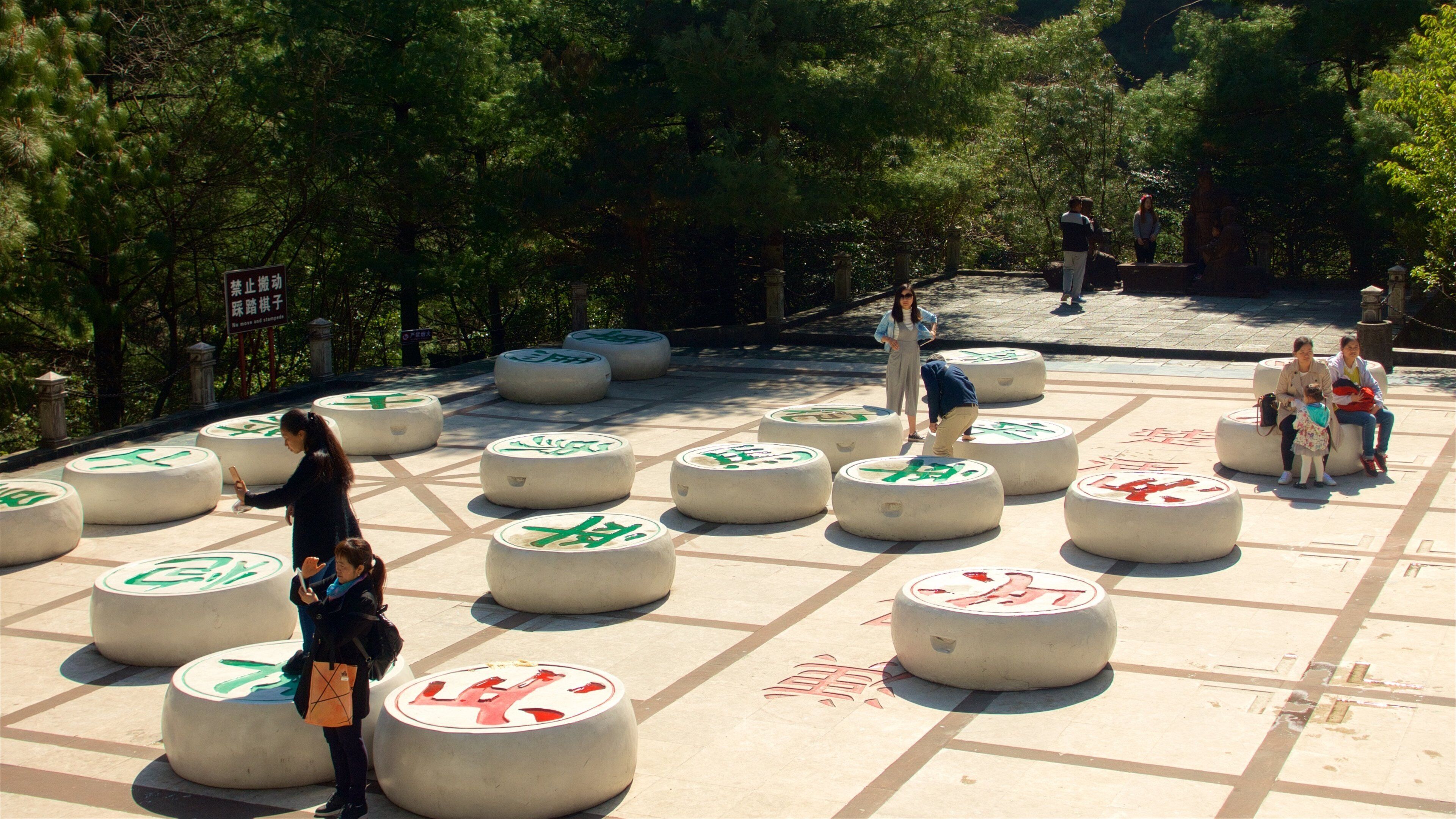 Cangshan Mountain which includes outdoor art and a garden as well as a small group of people