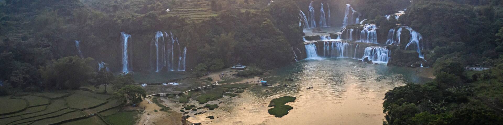 Aerial view of Detian Transnational Waterfalls along the river at Moon Hill Yangshuo valley, Chongzuo City, Yangshuo County, Guilin, Guangxi Zhuang Autonomous Region, China.