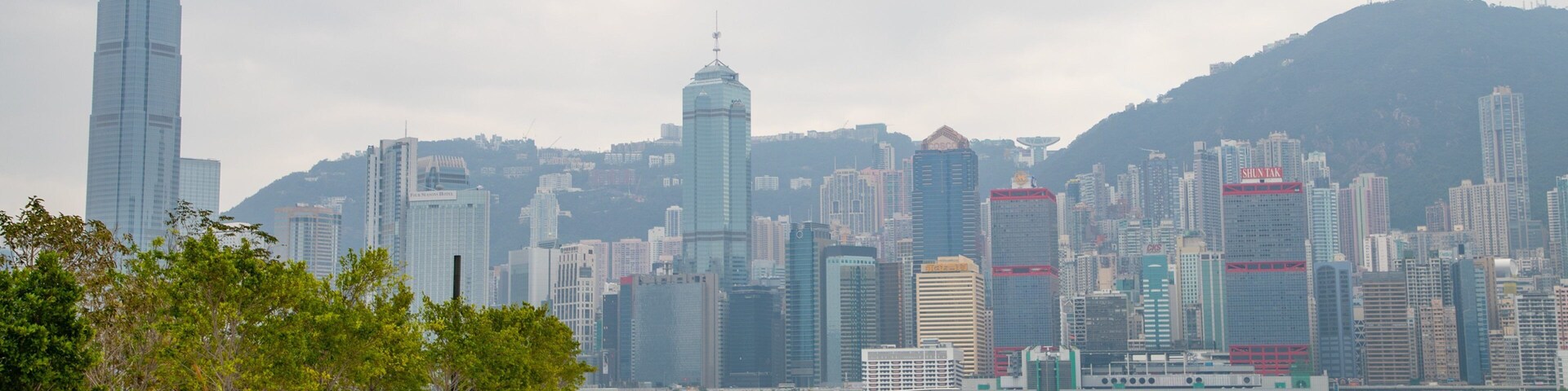 Kowloon West Promenade featuring a city and a bay or harbor as well as a couple
