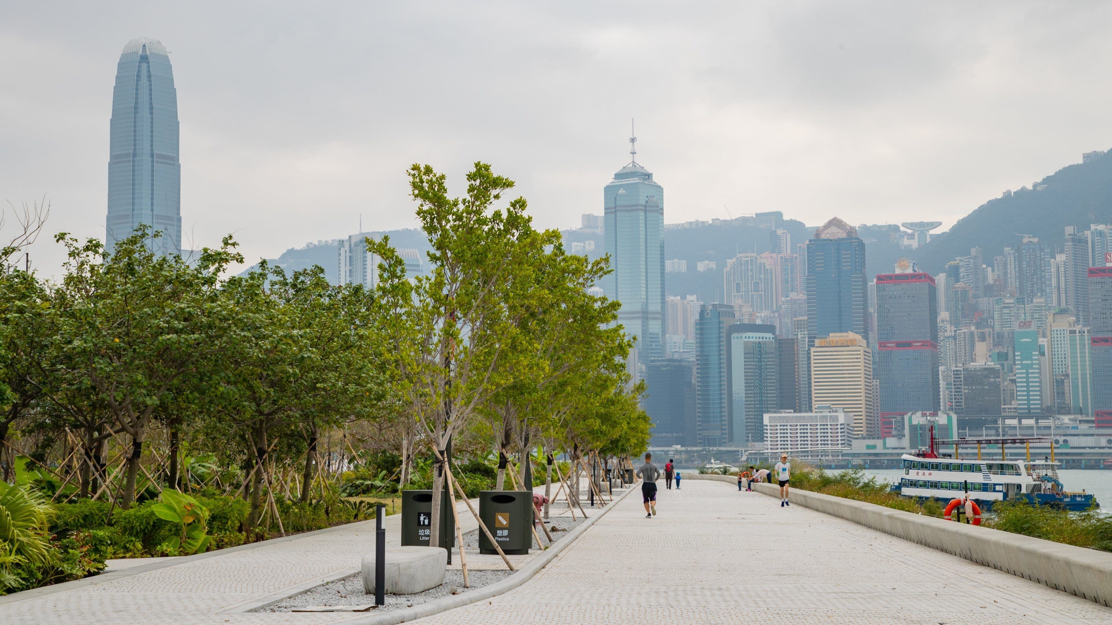 Kowloon West Promenade which includes a garden and a city