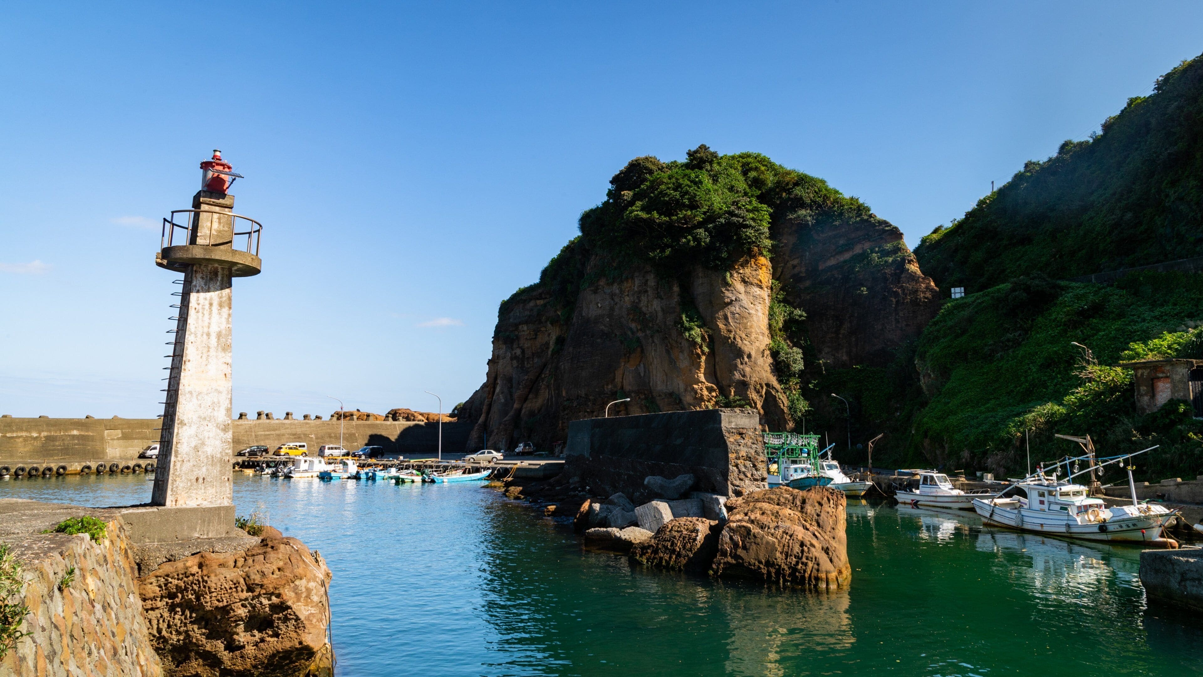 Yinyang Sea featuring rocky coastline, a lighthouse and a bay or harbor