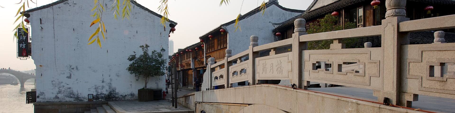 Jiaxing featuring a bridge, a small town or village and a river or creek