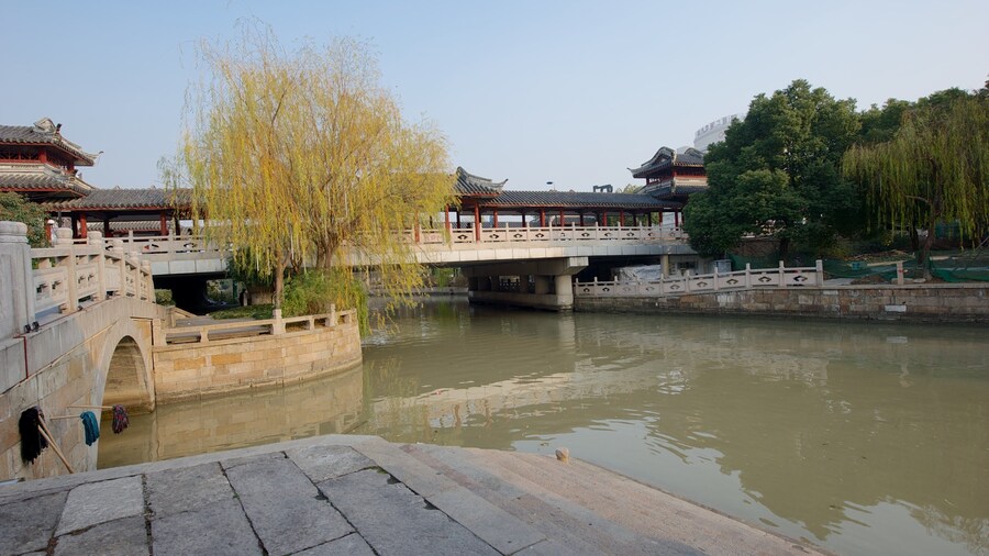 Jiaxing which includes a river or creek, a bridge and heritage architecture